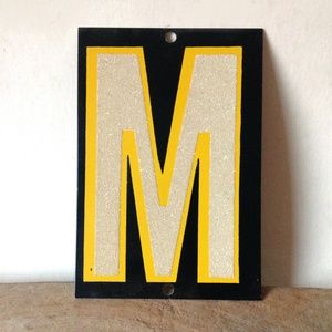 vintage reflective metal sign letter M